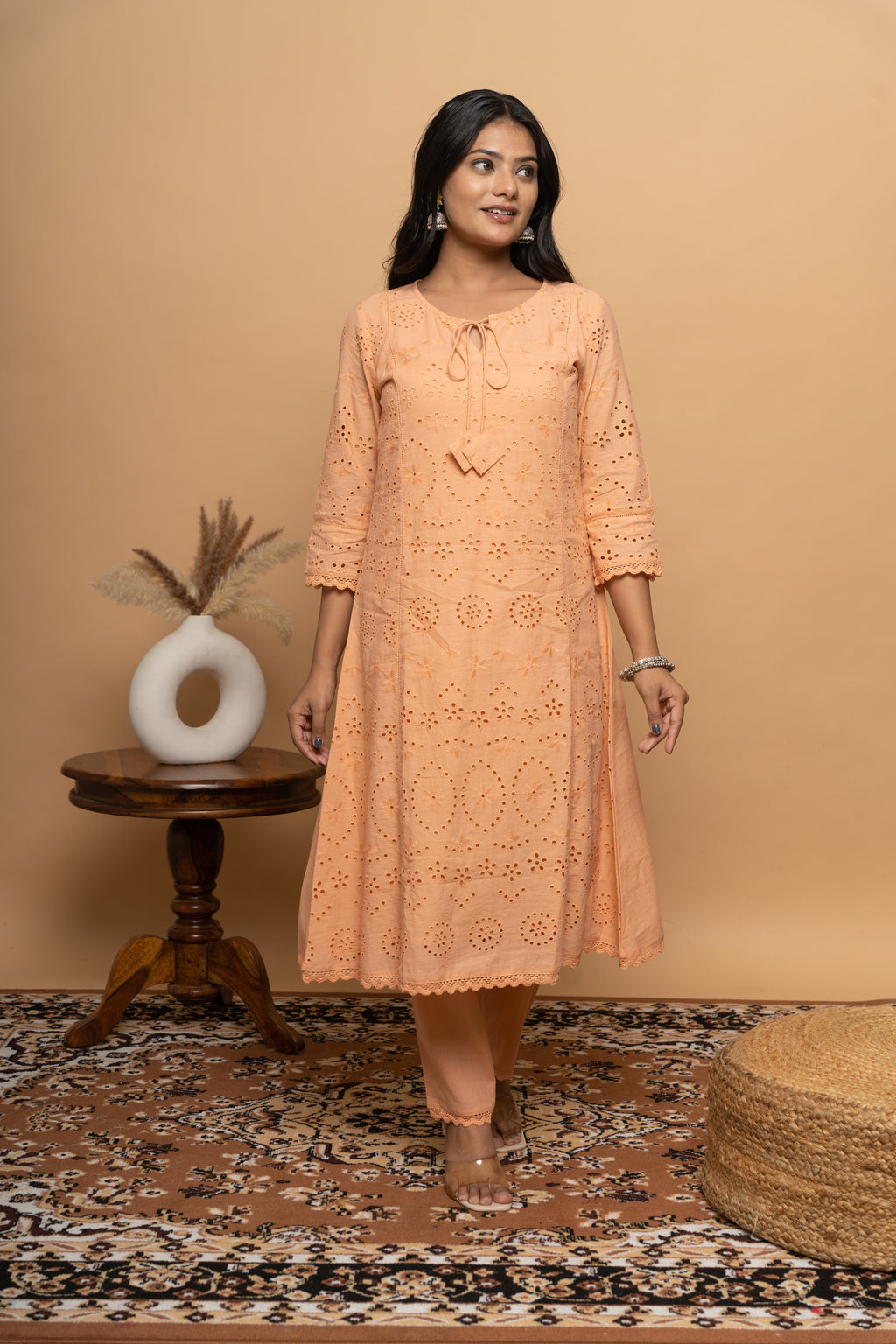 Front view of orange cotton suit set for women by Poshida
