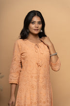 Front view of orange cotton suit set for women by Poshida