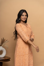 Side view of orange cotton suit set for women by Poshida