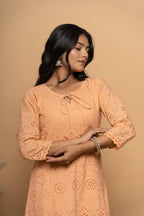 Front view of orange cotton suit set for women by Poshida