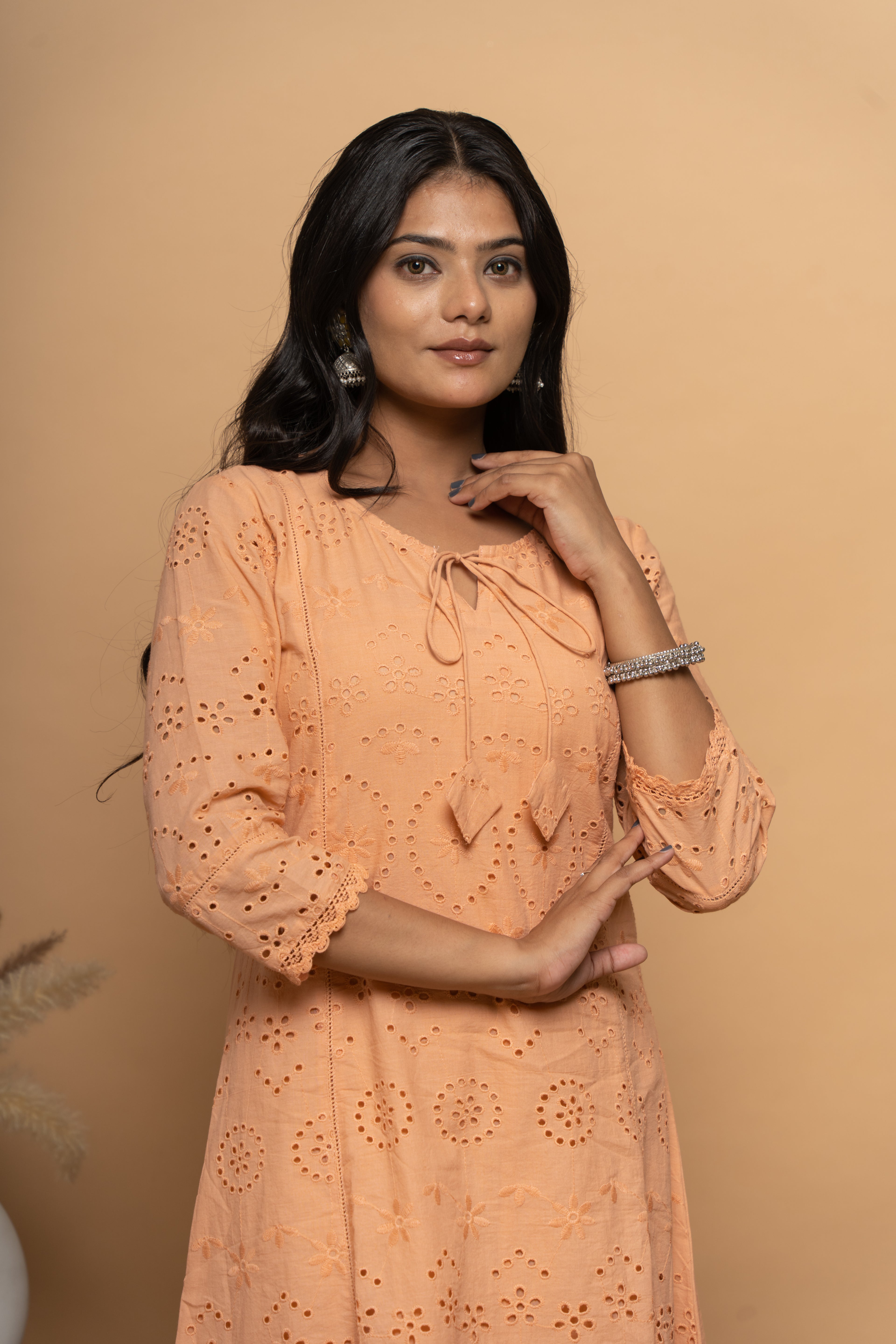 Front view of orange cotton suit set for women by Poshida