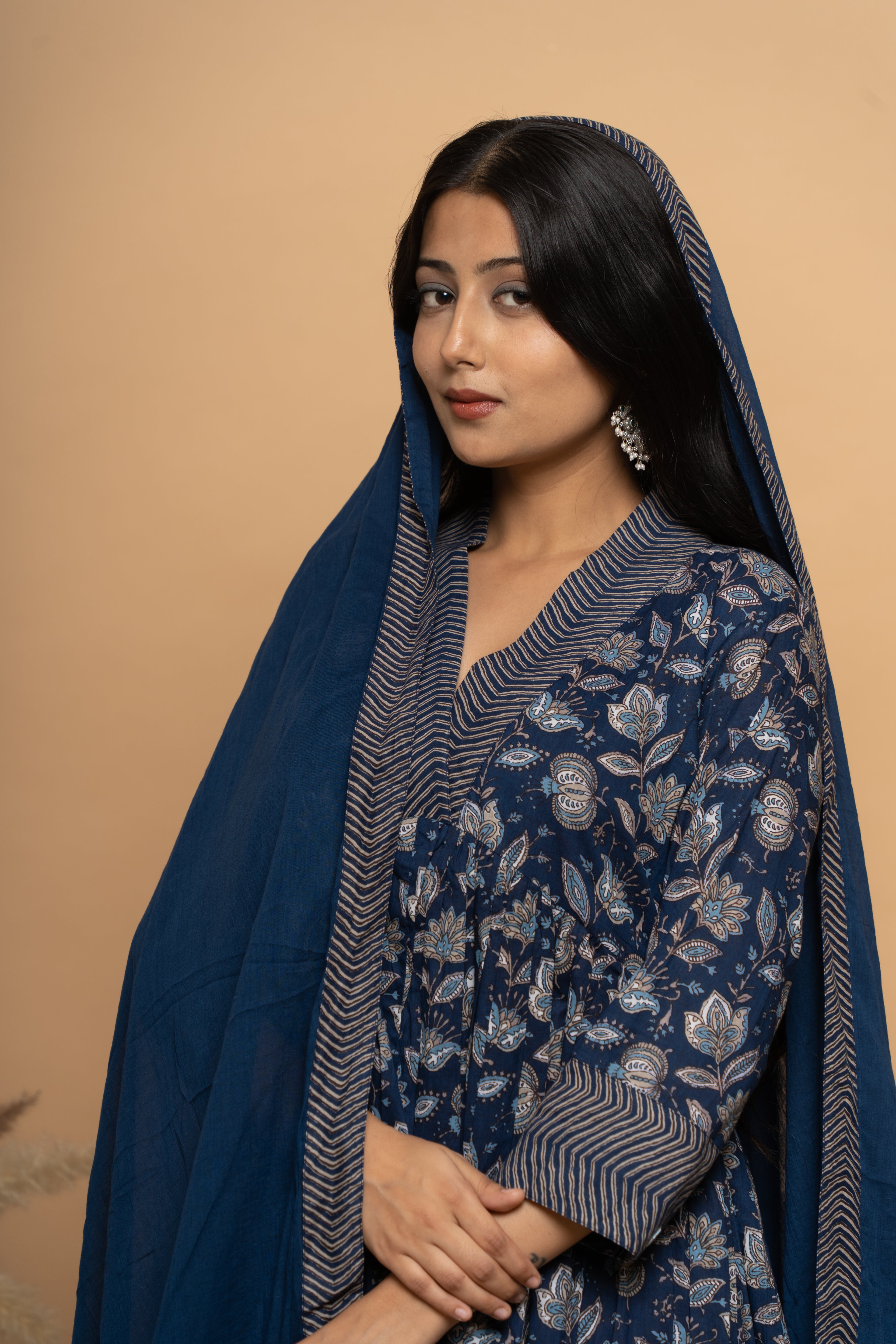 Close-up embroidery and fabric detail on indigo cotton suit set by Poshida