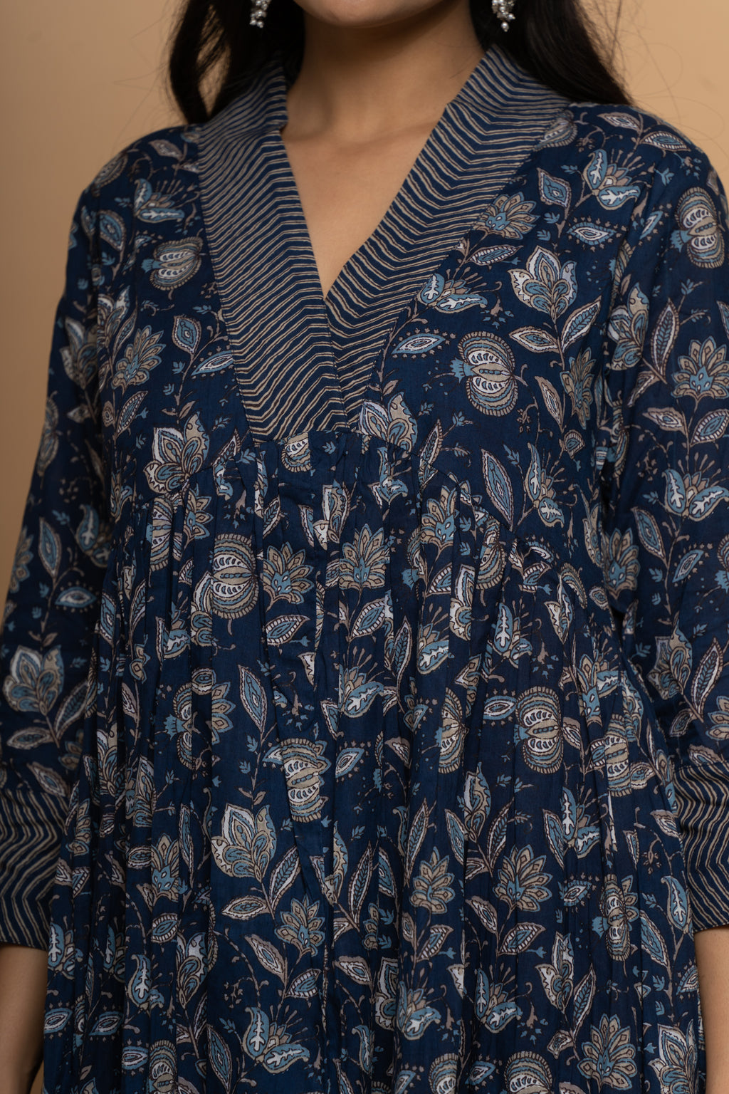 Close-up embroidery and fabric detail on indigo cotton suit set by Poshida