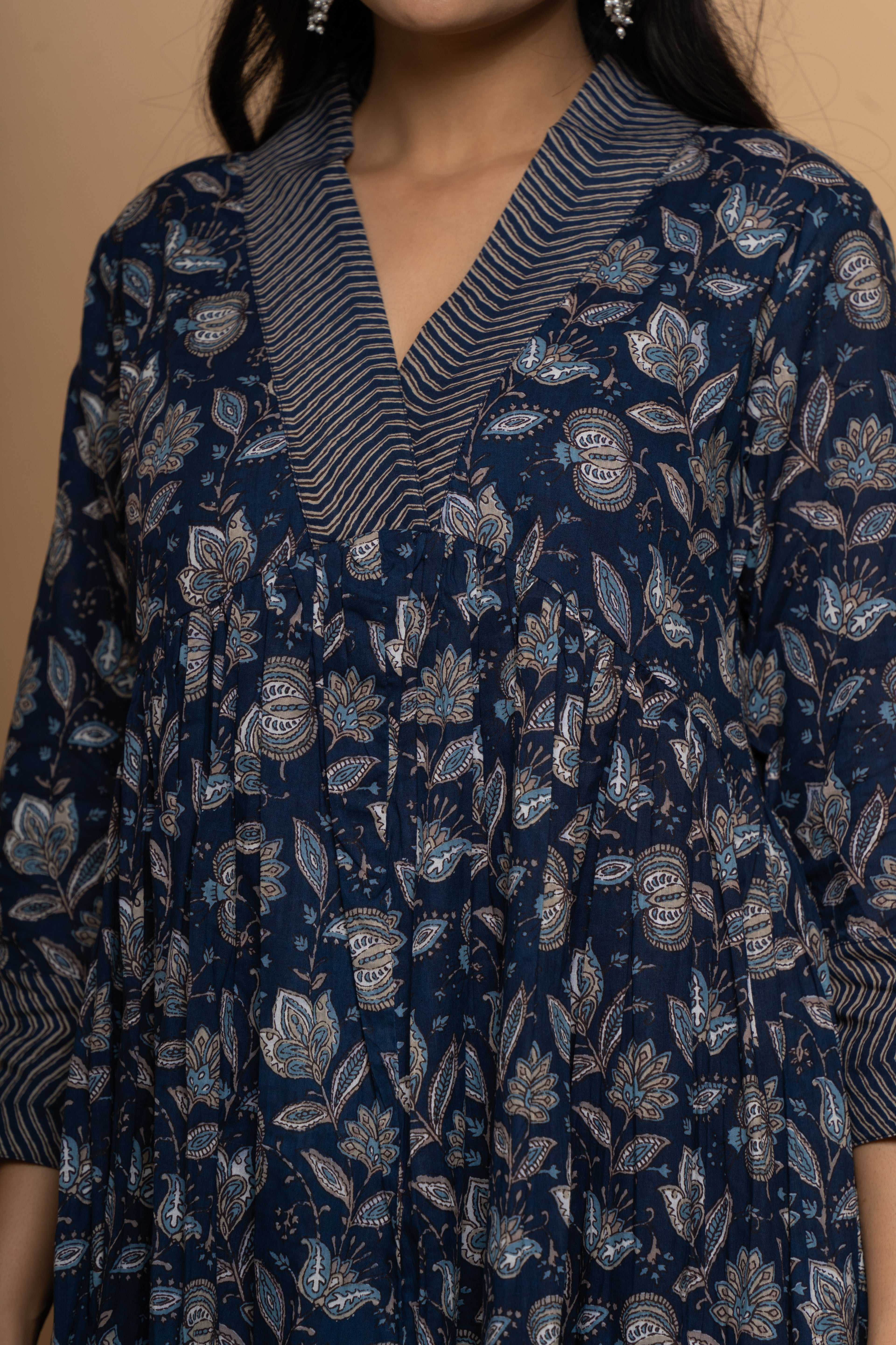 Close-up embroidery and fabric detail on indigo cotton suit set by Poshida