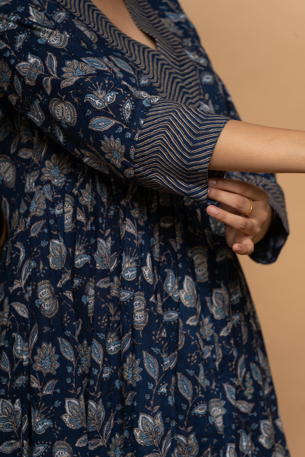 Close-up embroidery and fabric detail on indigo cotton suit set by Poshida