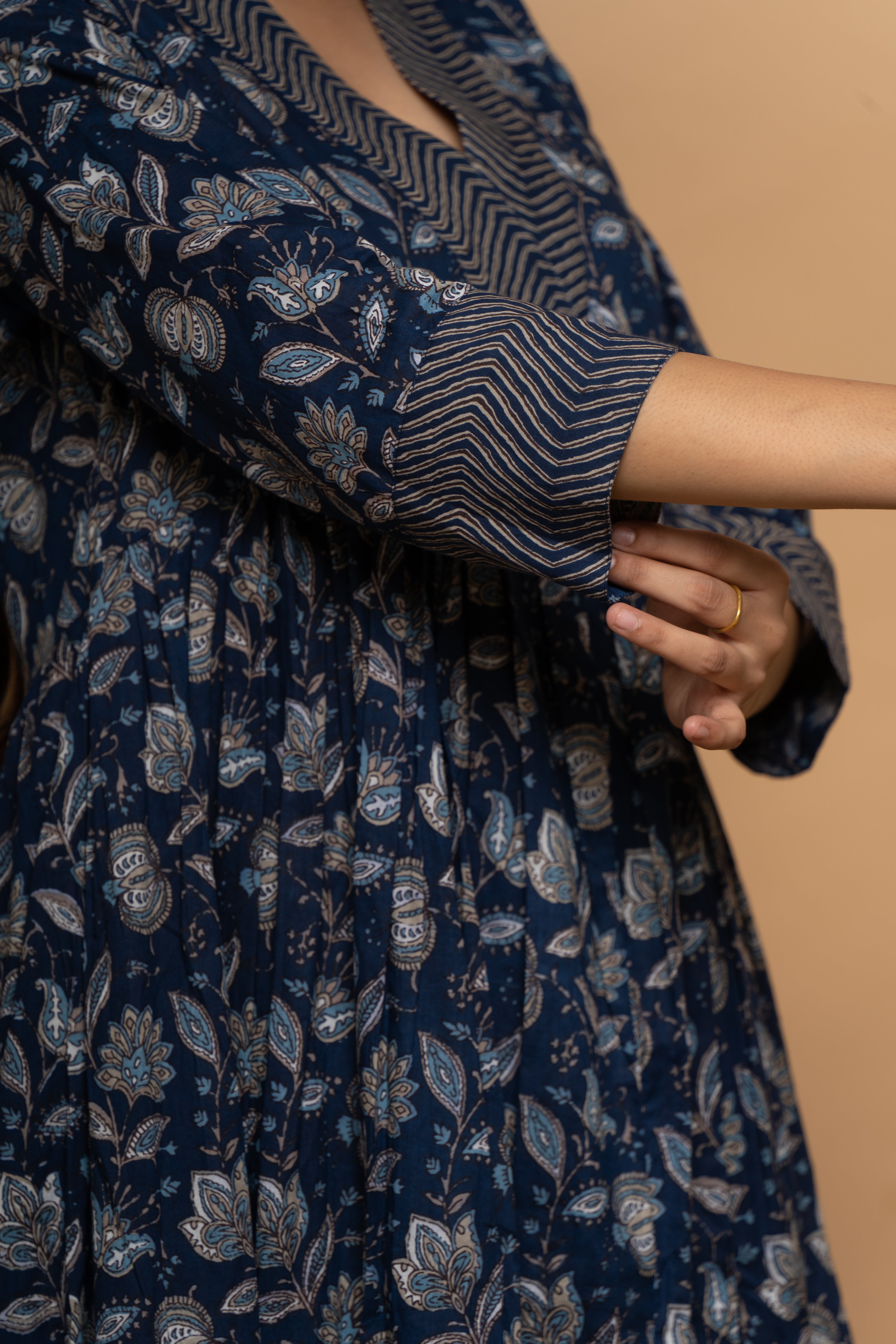 Close-up embroidery and fabric detail on indigo cotton suit set by Poshida