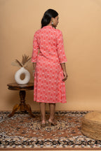Back view of women’s elegant orange rayon dress by Poshida