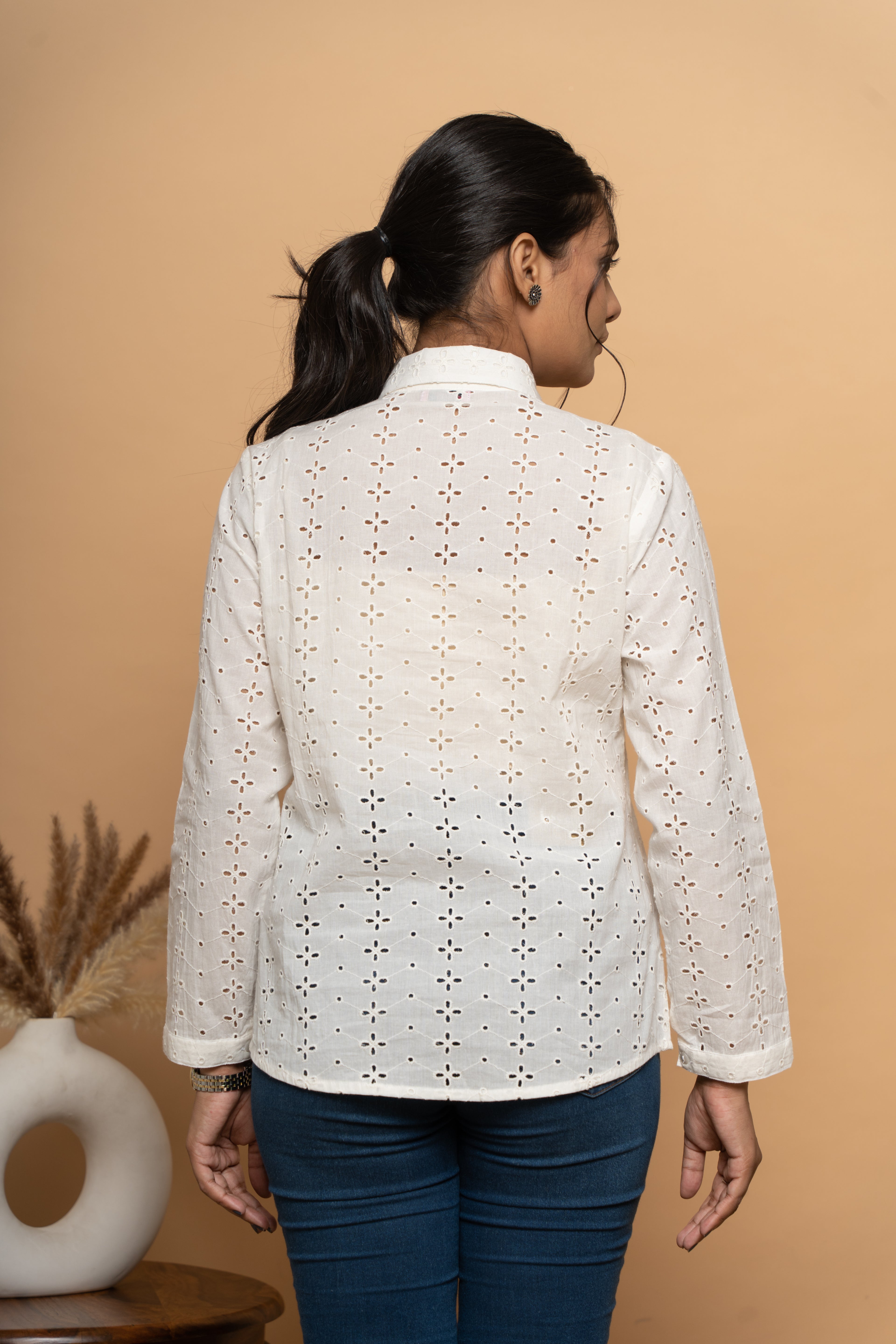 Back view of women’s white schiffli shirt by Poshida