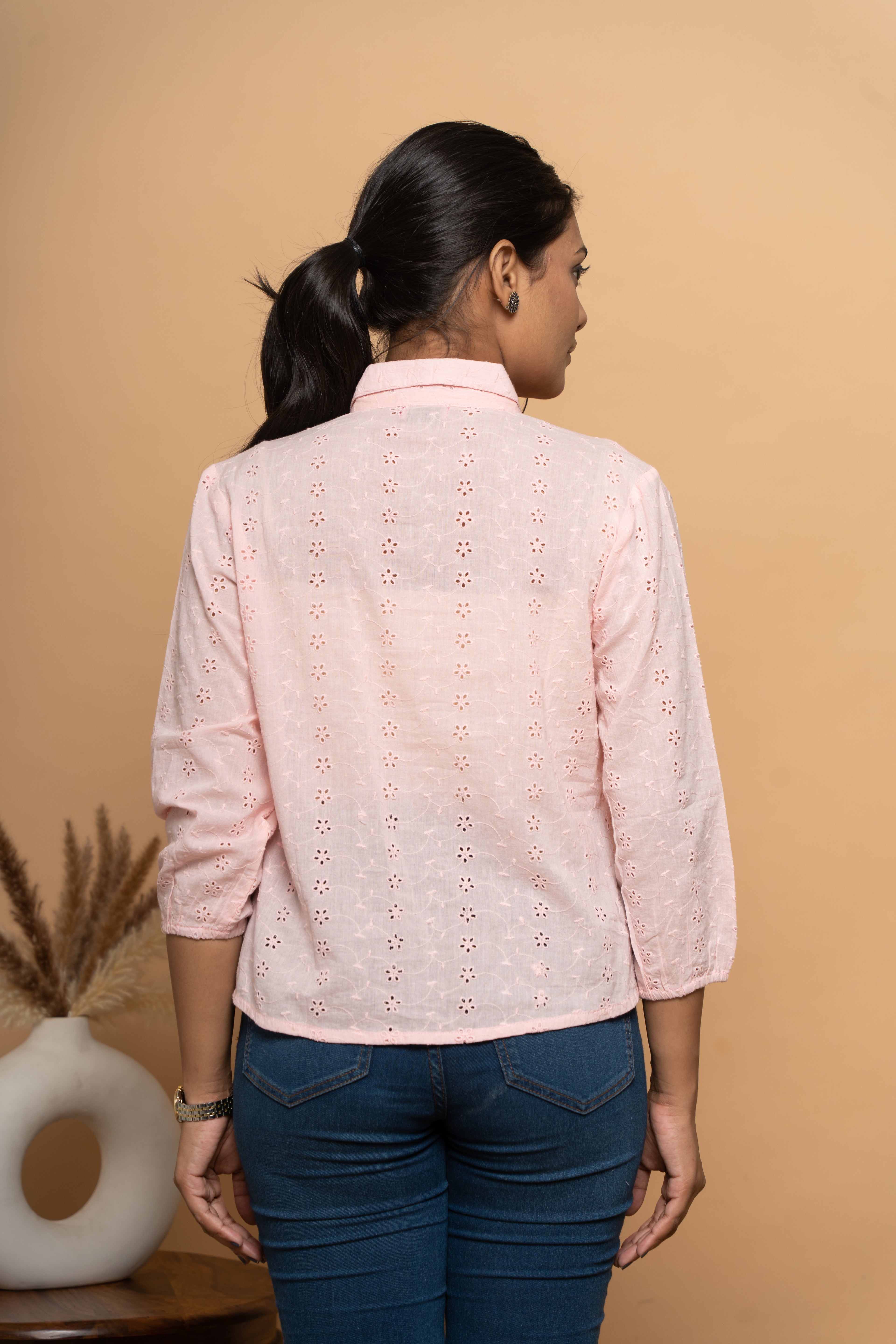 Back view of women’s light pink schiffli shirt by Poshida