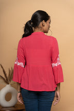 Back view of women’s elegant red embroidered top by Poshida