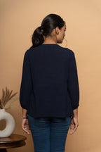 Back view of women’s indigo embroidered top by Poshida
