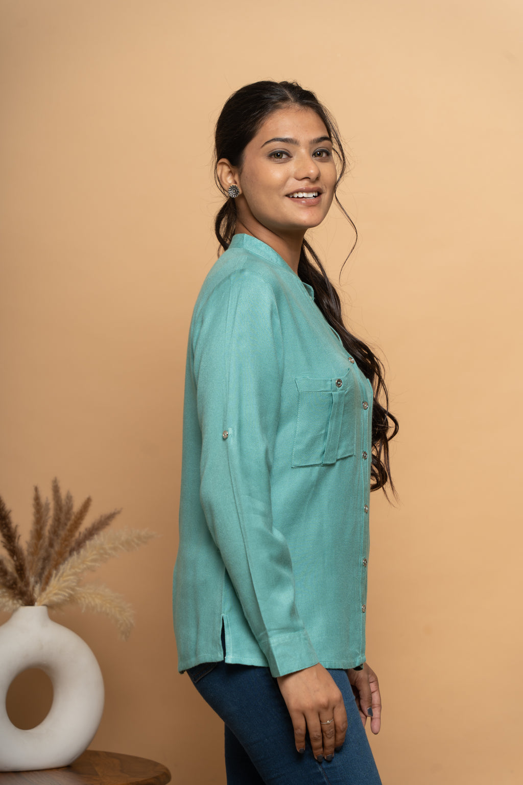 Side view of light blue embroidered women’s shirt by Poshida