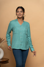Front view of light blue embroidery shirt for women by Poshida