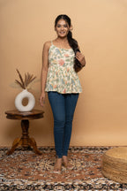 Sleeveless floral print flared top for women by Poshida