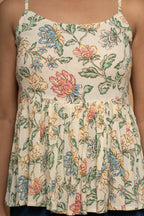 Close-up floral print detail on sleeveless flared top by Poshida