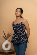 Close-up print detail on sleeveless indigo flared top by Poshida