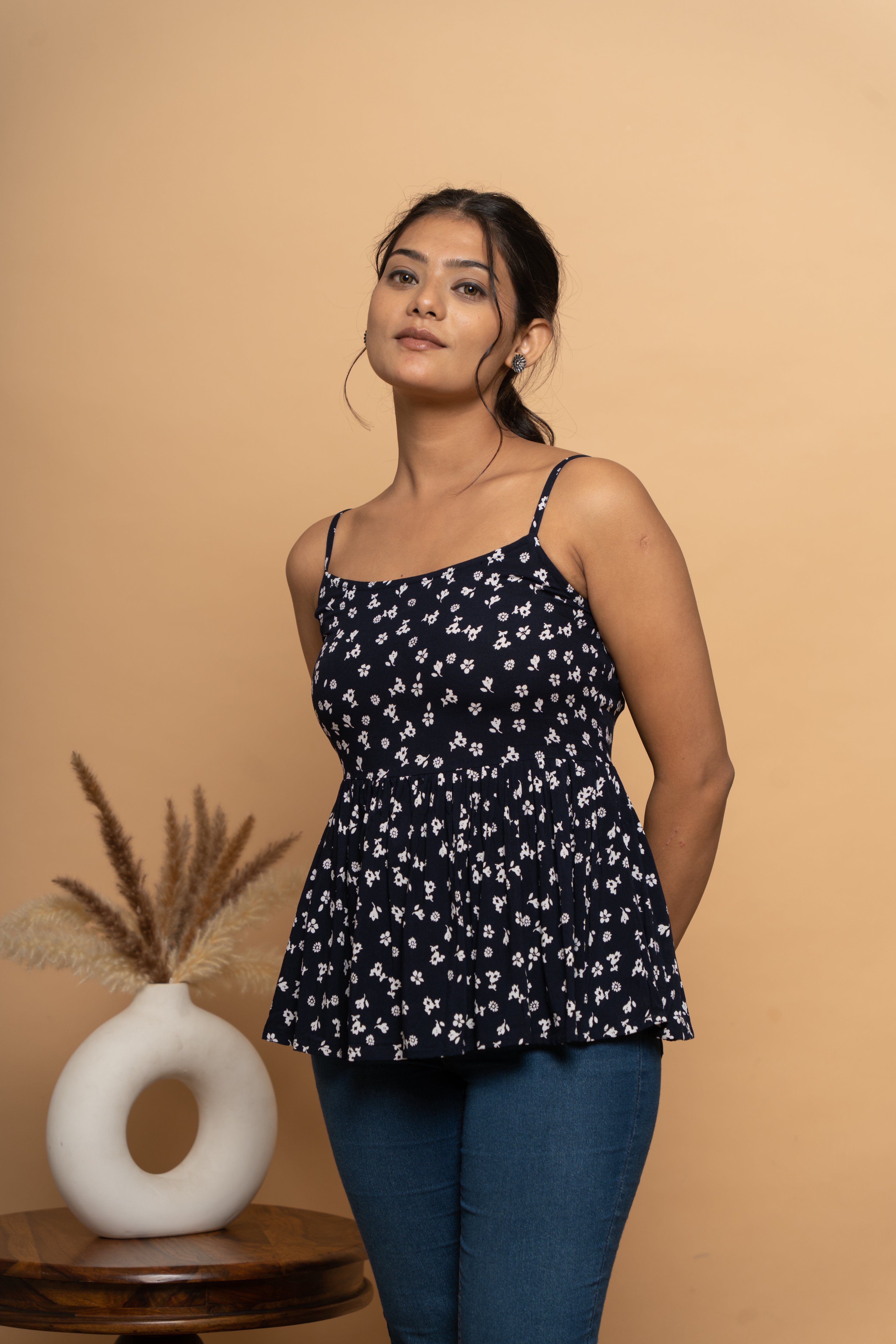 Close-up print detail on sleeveless indigo flared top by Poshida