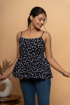 Front view of sleeveless indigo printed flared top by Poshida