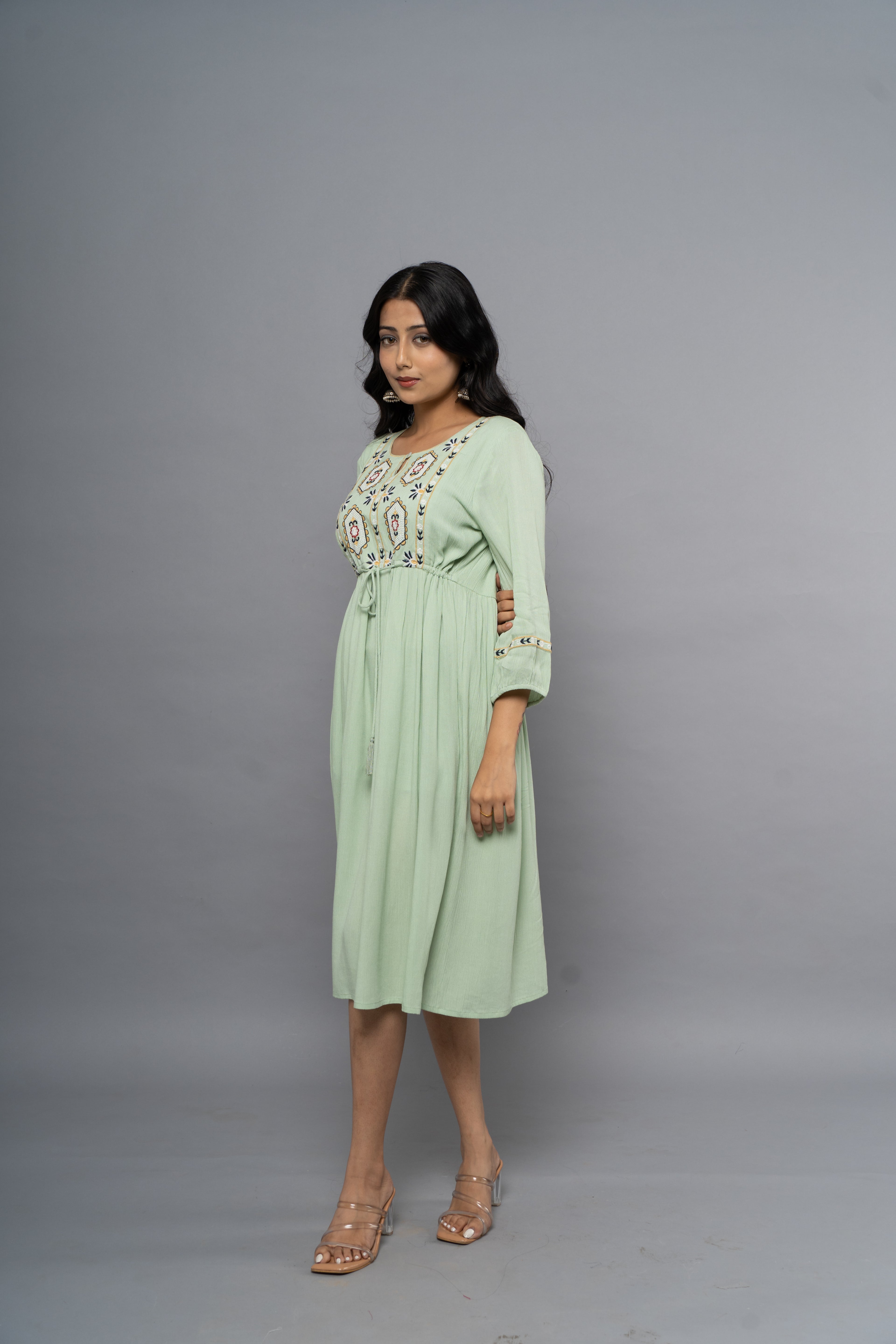 Side view of light green ethnic embroidery dress by Poshida