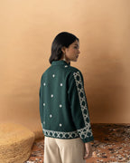 Back view of women’s green embroidered top by Poshida